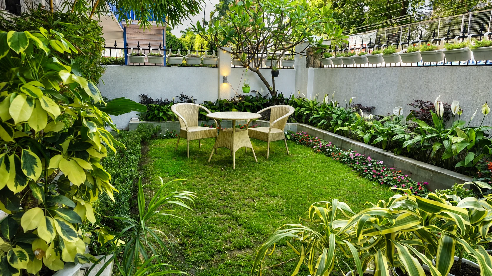 Lush green garden lawn at The Palatial Homes, a premium luxury homestay in Dehradun